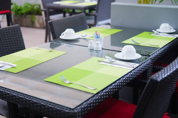 Prepare a table setting for breakfast in hotel